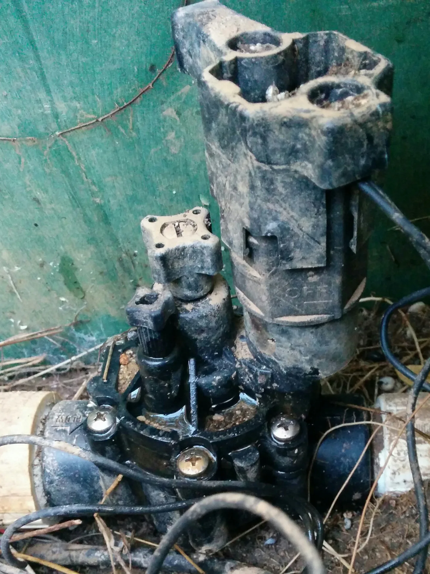 JLS technicians repairing sprinkler system on residential lawn