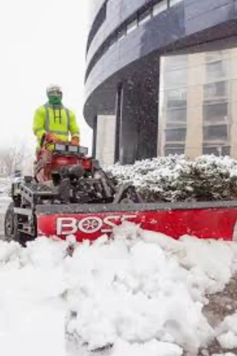 Spring snowstorm covering a commercial walkway in Denver