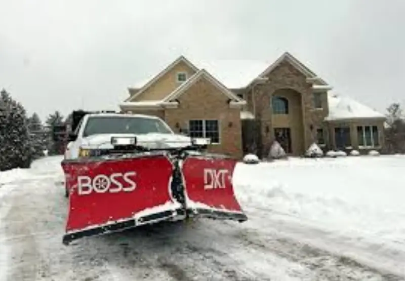 JLS snow removal equipment clearing a commercial parking lot in Parker
